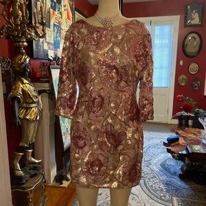 Sequin dress. Pink with gold accents. Sexy style.